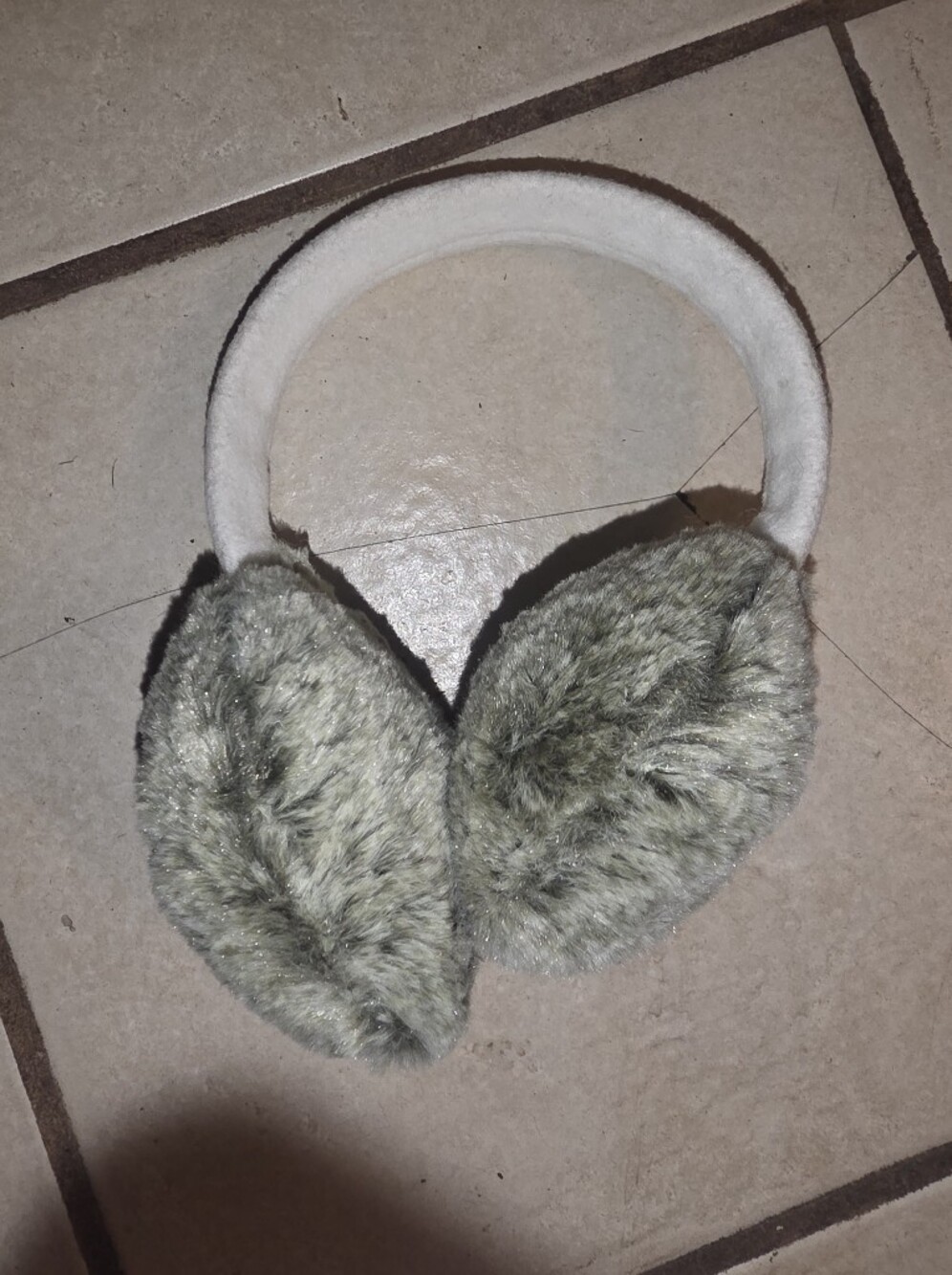 Grey and white faux fur earmuffs with a plush band